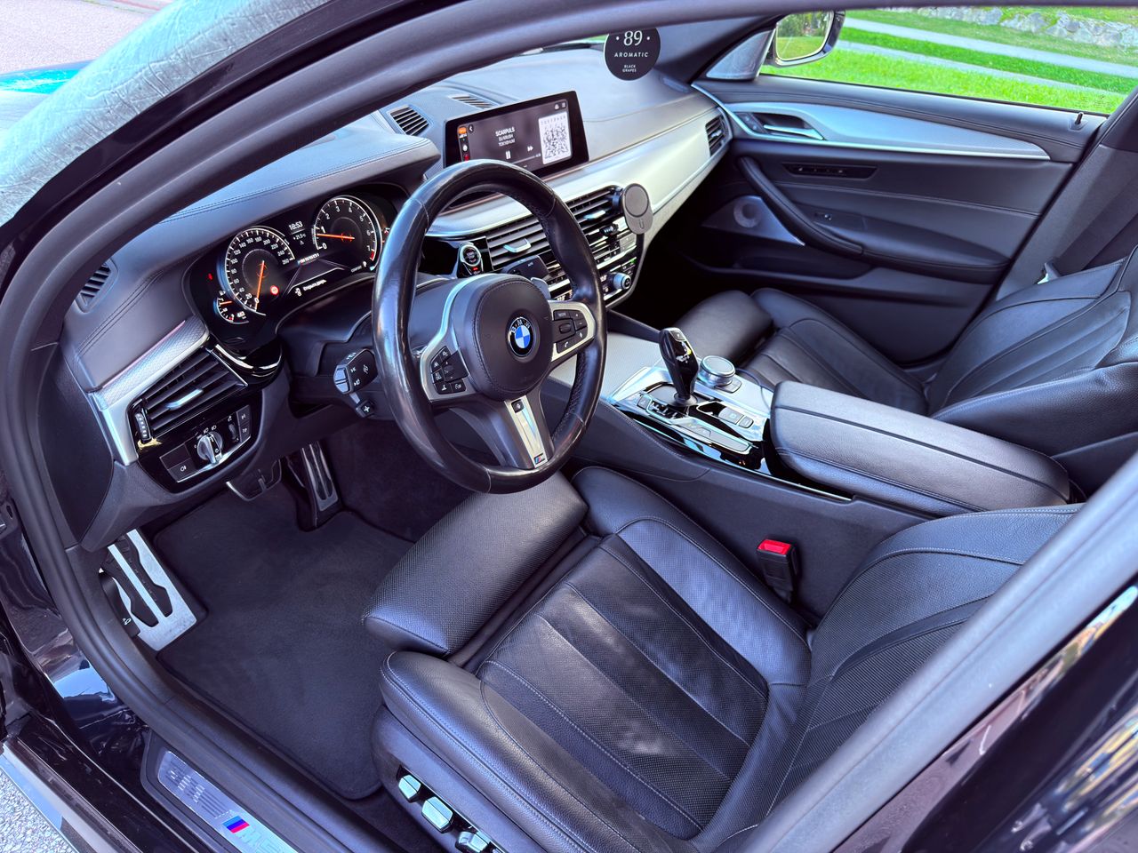 Explore the sleek and elegant interior of a luxury car featuring advanced dashboard technology.